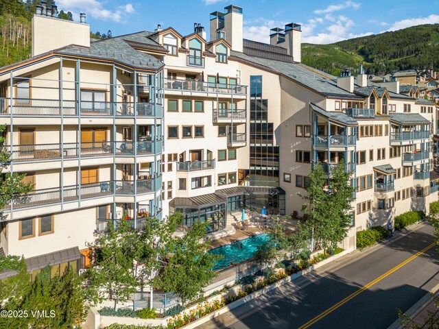 view of building exterior with a mountain view