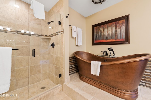 bathroom featuring tile patterned floors and a shower with shower door