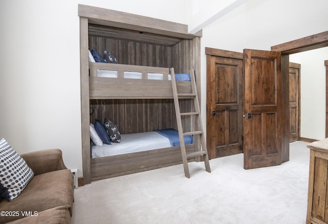 bedroom featuring light carpet