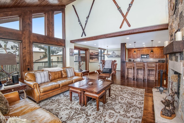 living room featuring an inviting chandelier, high vaulted ceiling, wooden ceiling, and light wood-type flooring