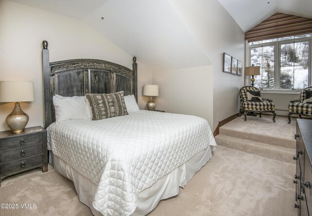 carpeted bedroom featuring vaulted ceiling