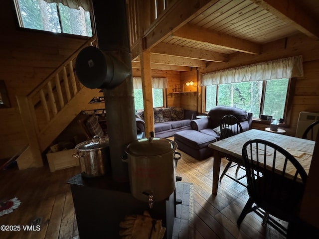 1234 6th St, Eagle, CO 81631 - living room featuring wooden walls, wood-type flooring, and a wooden ceiling with exposed beams