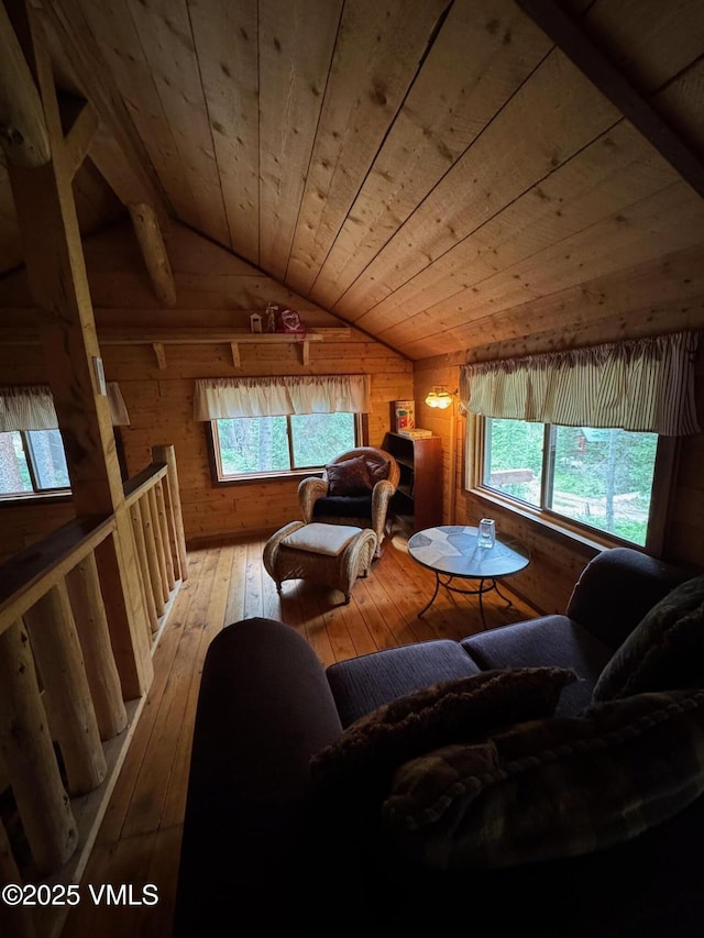 1234 6th St, Eagle, CO 81631 - living room with wood walls, lofted ceiling, plenty of natural light, light wood-type flooring, and wooden ceiling
