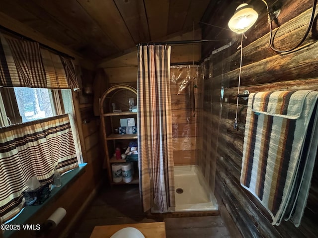 1234 6th St, Eagle, CO 81631 - full bathroom featuring a shower stall, vaulted ceiling, wood walls, and wood ceiling