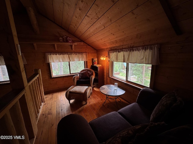 1234 6th St, Eagle, CO 81631 - living area with wood walls, vaulted ceiling, plenty of natural light, hardwood / wood-style flooring, and wood ceiling