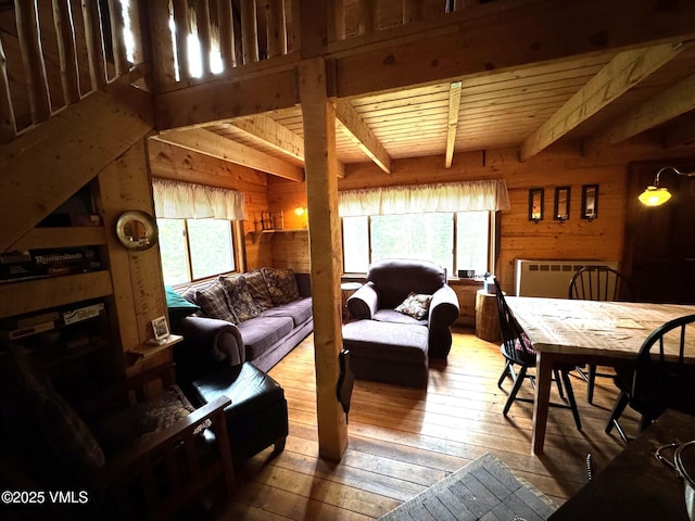 1234 6th St, Eagle, CO 81631 - living area featuring wood-type flooring, wood walls, and a wooden ceiling with exposed beams
