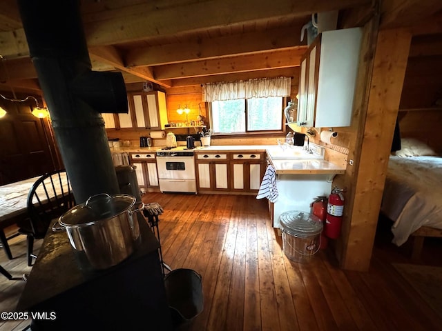 1234 6th St, Eagle, CO 81631 - kitchen with white range oven, light countertops, hardwood / wood-style flooring, and wood walls