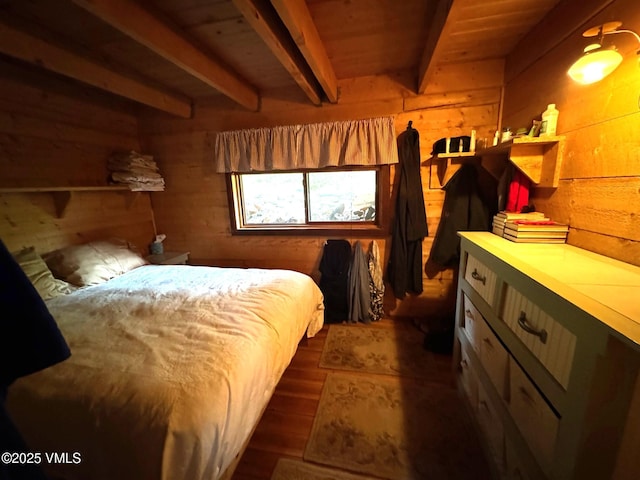 1234 6th St, Eagle, CO 81631 - bedroom with wooden walls, beamed ceiling, and dark wood-style floors