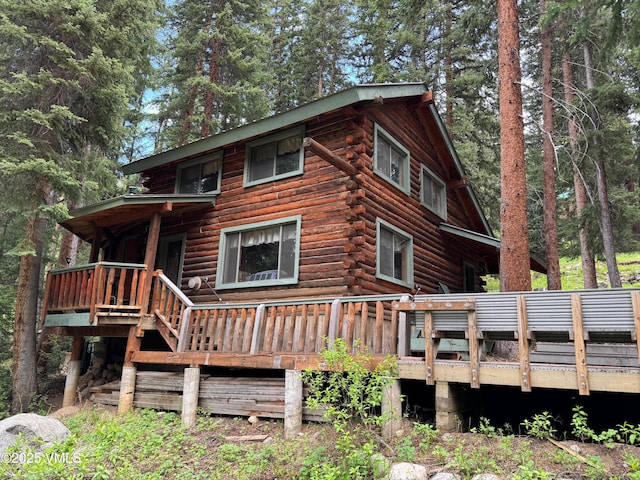 1234 6th St, Eagle, CO 81631 - back of property featuring log exterior and a deck