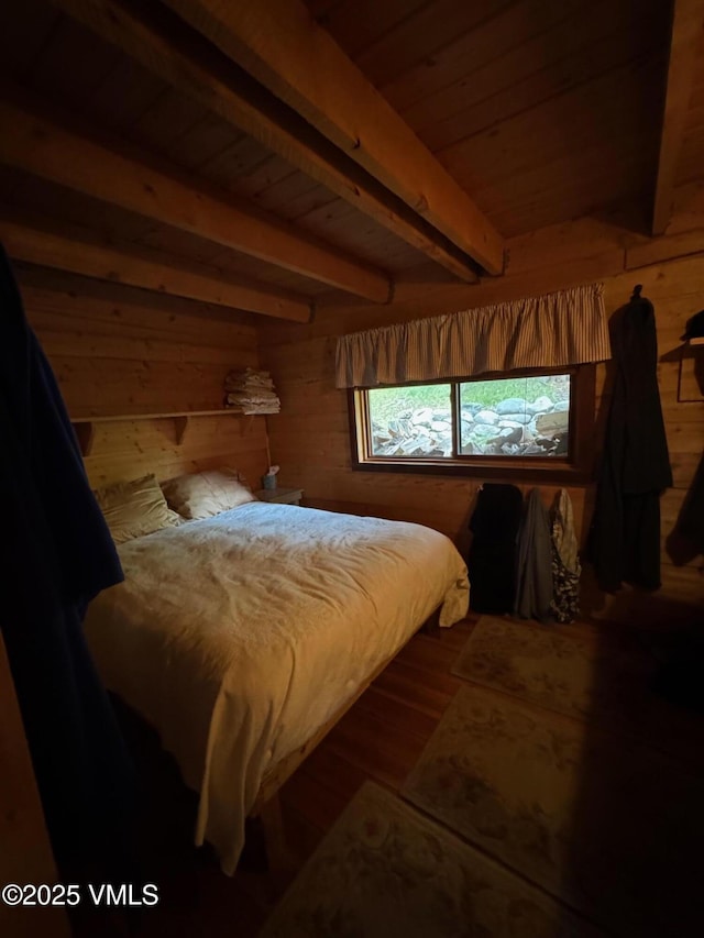 1234 6th St, Eagle, CO 81631 - bedroom with wood walls, wood finished floors, and a wooden ceiling with exposed beams