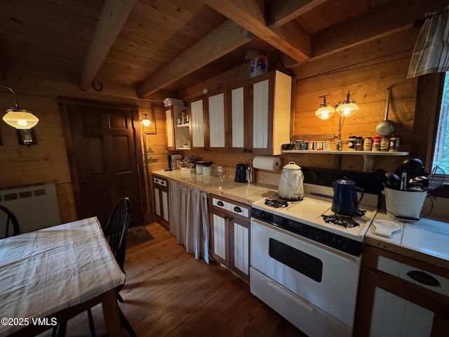 1234 6th St, Eagle, CO 81631 - kitchen featuring white gas range oven, open shelves, wood walls, hardwood / wood-style floors, and a wooden ceiling with exposed beams