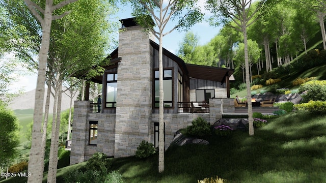 view of side of property featuring stone siding and a chimney