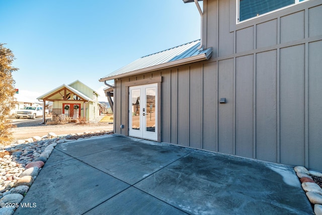 329 River Frontage Rd Unit 18, Silt, CO 81652 - exterior space with a patio area, metal roof, board and batten siding, and french doors