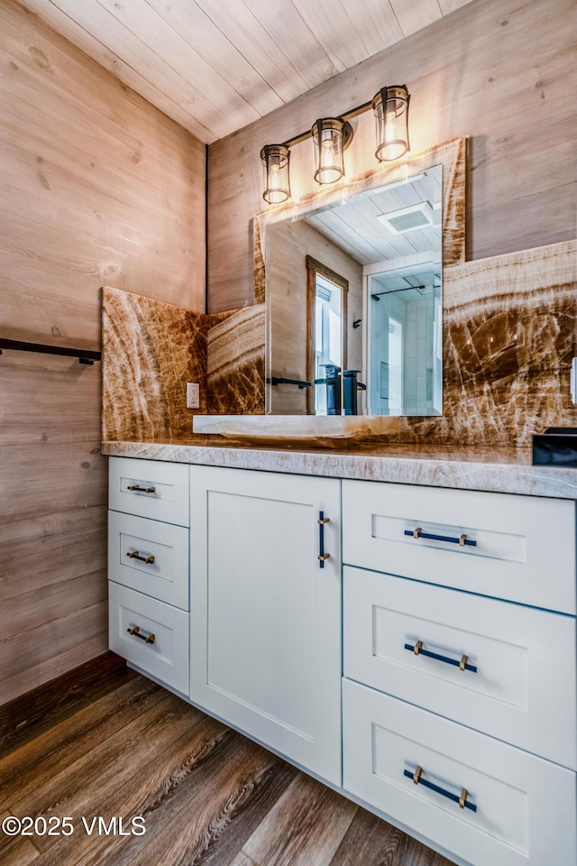 329 River Frontage Rd Unit 18, Silt, CO 81652 - bathroom featuring wooden ceiling, wood walls, wood finished floors, and vanity
