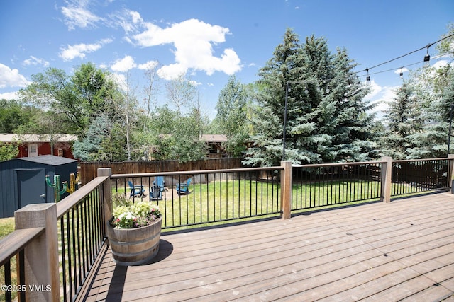 349 Whiting Rd, Eagle, CO 81631 - deck with a shed, a fire pit, and a fenced backyard