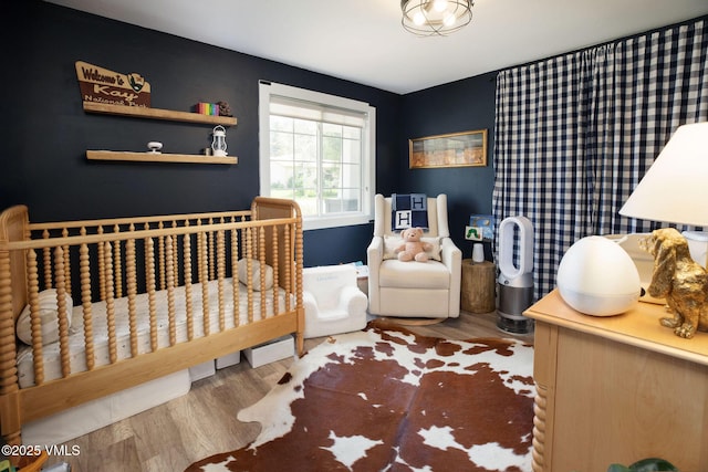 349 Whiting Rd, Eagle, CO 81631 - bedroom with wood finished floors and a nursery area