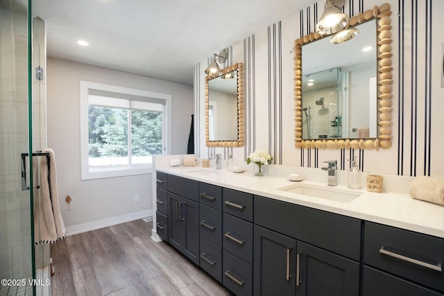 349 Whiting Rd, Eagle, CO 81631 - bathroom with double vanity, wood finished floors, tiled shower, and recessed lighting
