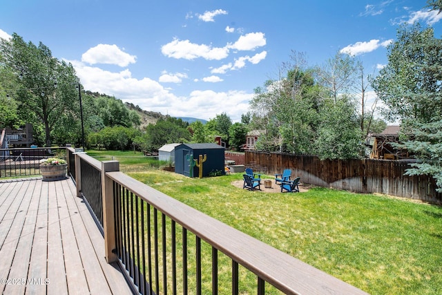 349 Whiting Rd, Eagle, CO 81631 - wooden terrace with a storage shed, an outdoor fire pit, and a fenced backyard