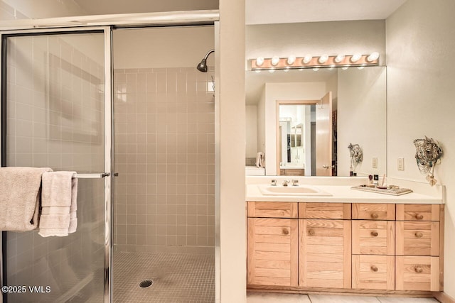 full bathroom with vanity and a stall shower