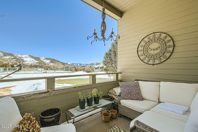 exterior space with a mountain view and an outdoor hangout area