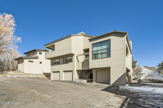 back of house with an attached garage