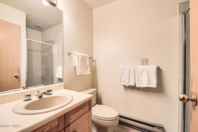 bathroom with a baseboard heating unit, toilet, vanity, and a tile shower