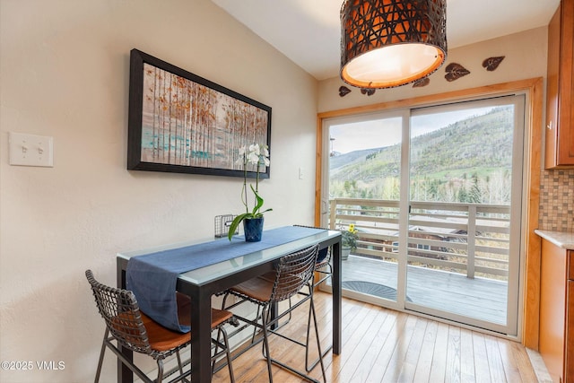 5024 Main Gore Dr S Unit 16, Vail, CO 81657 - dining space with light wood-style floors and a mountain view