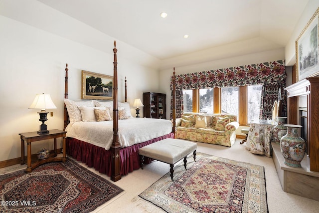 bedroom with recessed lighting, baseboards, a raised ceiling, and light carpet