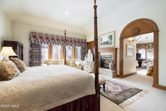 carpeted bedroom featuring recessed lighting and a premium fireplace