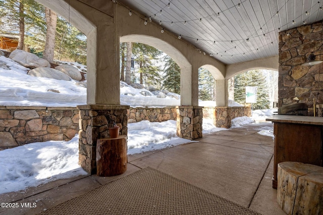 view of snow covered patio