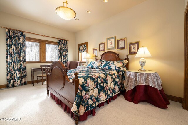 bedroom with baseboards and carpet floors