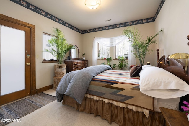 bedroom with carpet flooring, baseboards, and visible vents