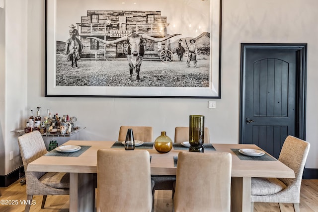 dining space featuring wood finished floors