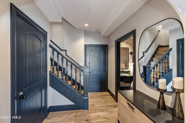 entrance foyer featuring recessed lighting, stairway, and light wood-style floors