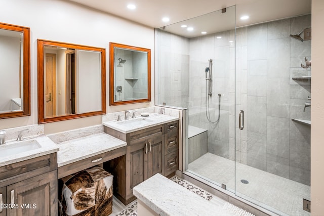 full bathroom with a stall shower, vanity, and recessed lighting