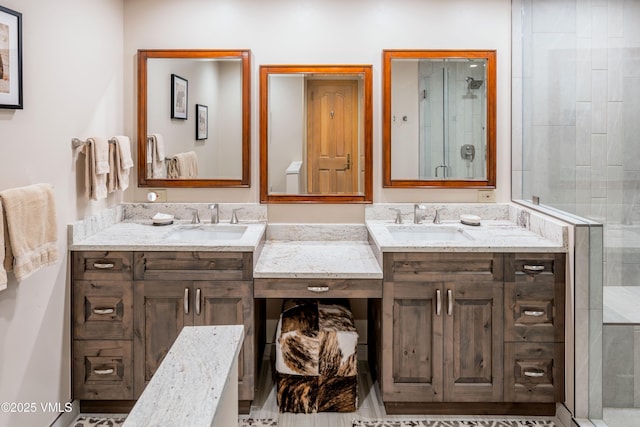 full bath with a stall shower and vanity