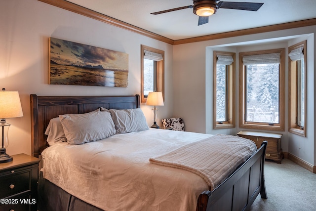 bedroom featuring light carpet, multiple windows, baseboards, and crown molding