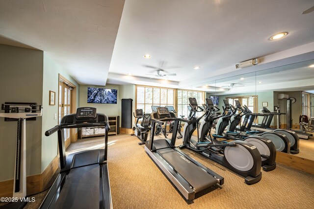 gym with ceiling fan and carpet floors