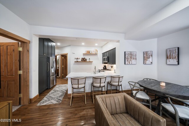 dining area featuring dark hardwood / wood-style flooring