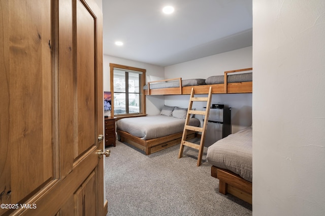 bedroom featuring light colored carpet