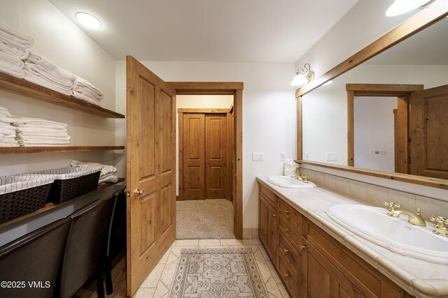 bathroom featuring tile patterned floors and vanity