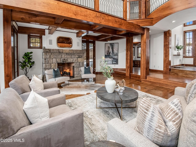 460 El Mirador Rd, Edwards, CO 81632 - living room with hardwood / wood-style floors, a fireplace, beamed ceiling, and baseboards