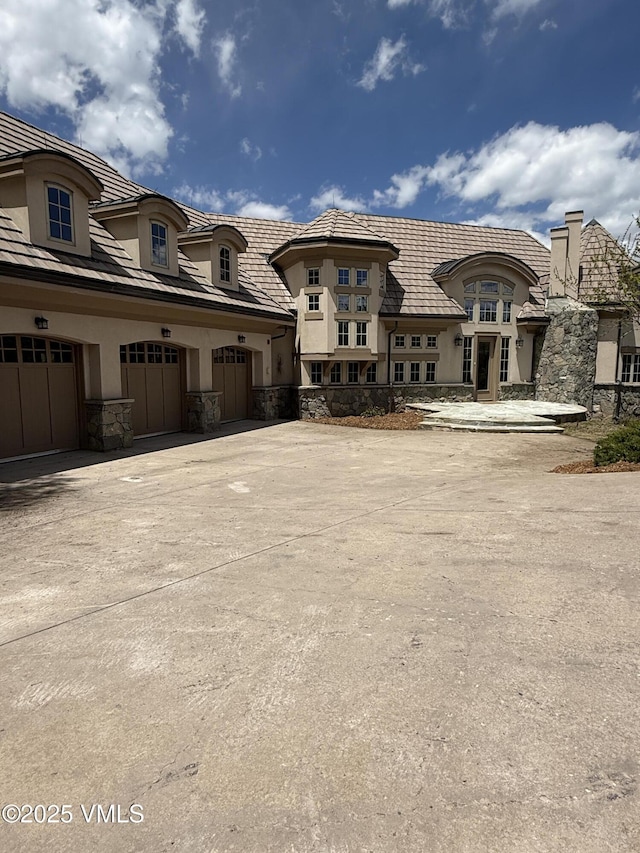 460 El Mirador Rd, Edwards, CO 81632 - view of property with concrete driveway and a garage