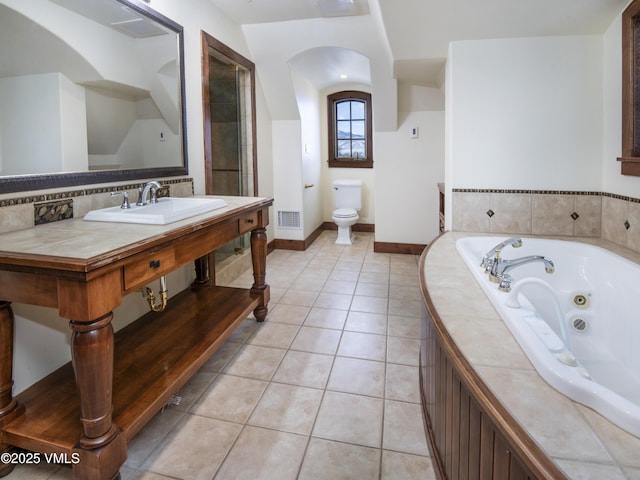 460 El Mirador Rd, Edwards, CO 81632 - bathroom with a jetted tub, toilet, a sink, tile patterned flooring, and baseboards