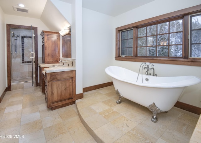 460 El Mirador Rd, Edwards, CO 81632 - bathroom featuring vanity, a freestanding tub, a shower stall, and baseboards