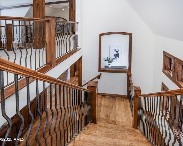 460 El Mirador Rd, Edwards, CO 81632 - stairs featuring wood finished floors, baseboards, and vaulted ceiling