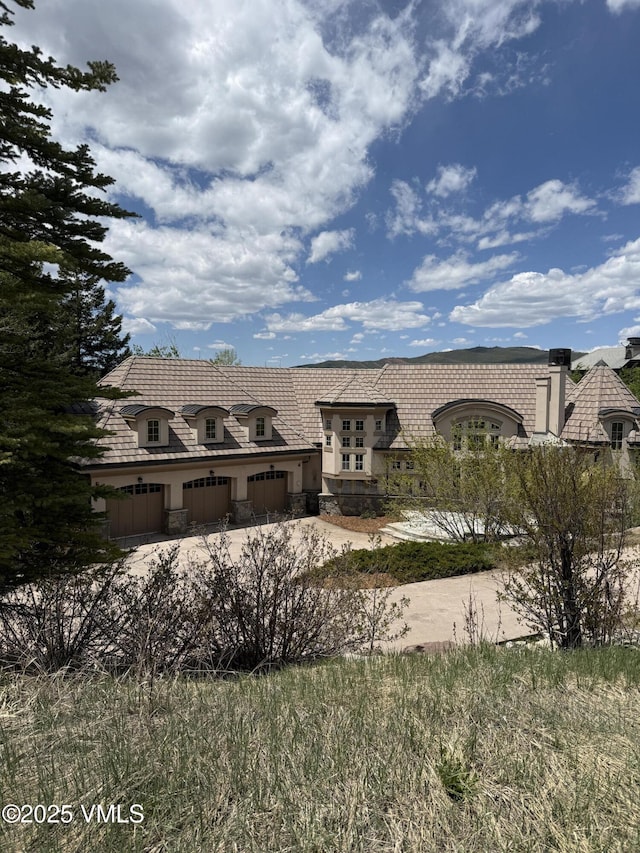 460 El Mirador Rd, Edwards, CO 81632 - french country home featuring driveway, stone siding, and stucco siding