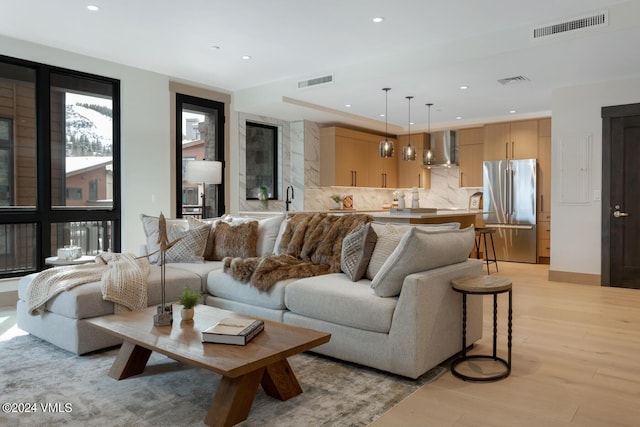 living room with light hardwood / wood-style floors