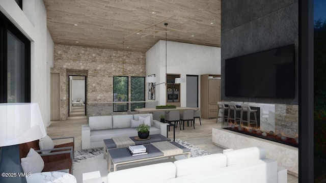 living area with light wood finished floors and a high ceiling