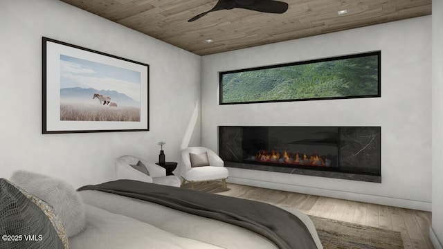 bedroom featuring wooden ceiling, a glass covered fireplace, hardwood / wood-style flooring, and a ceiling fan